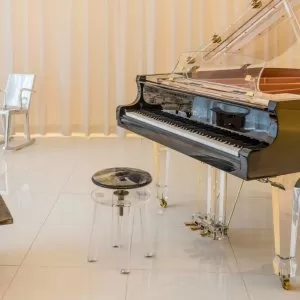 A piano sitting in the middle of a room.