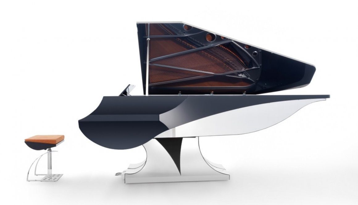 A black and white piano is sitting on top of a table.