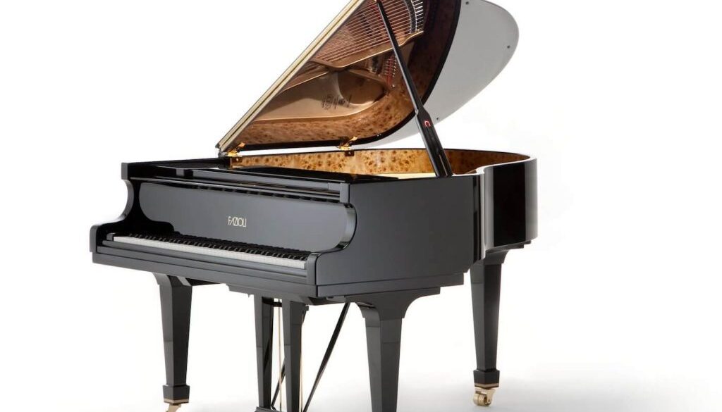 A black piano with gold keys and feet