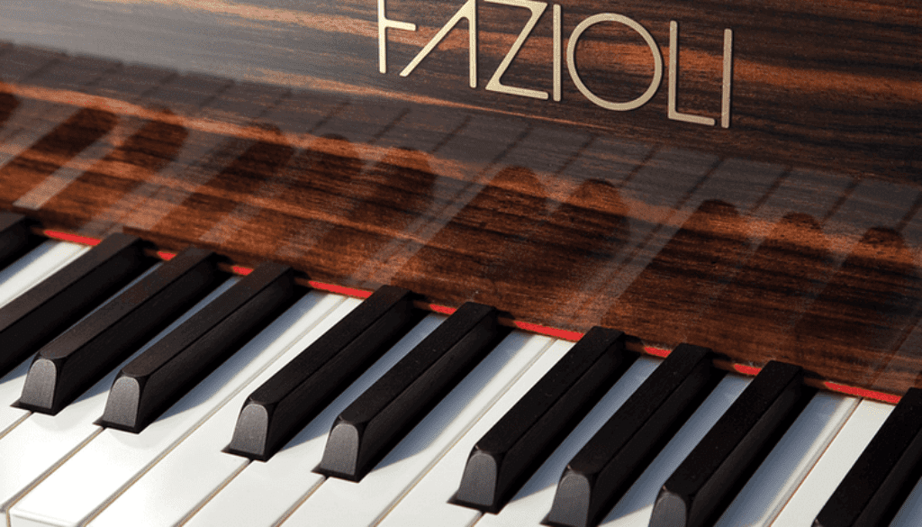 A piano with the word " fazioli " on it.