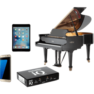 A piano sitting next to an ipad and another tablet.