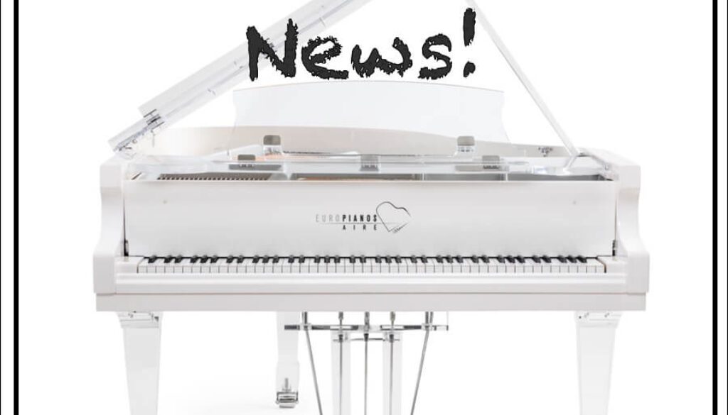 A white piano with the words " aire in the news !" above it.