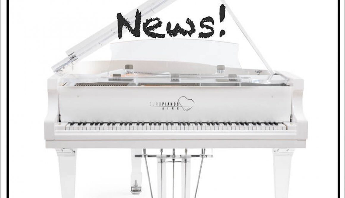 A white piano with the words " aire in the news !" above it.