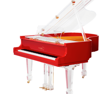 A red piano with white legs and top.