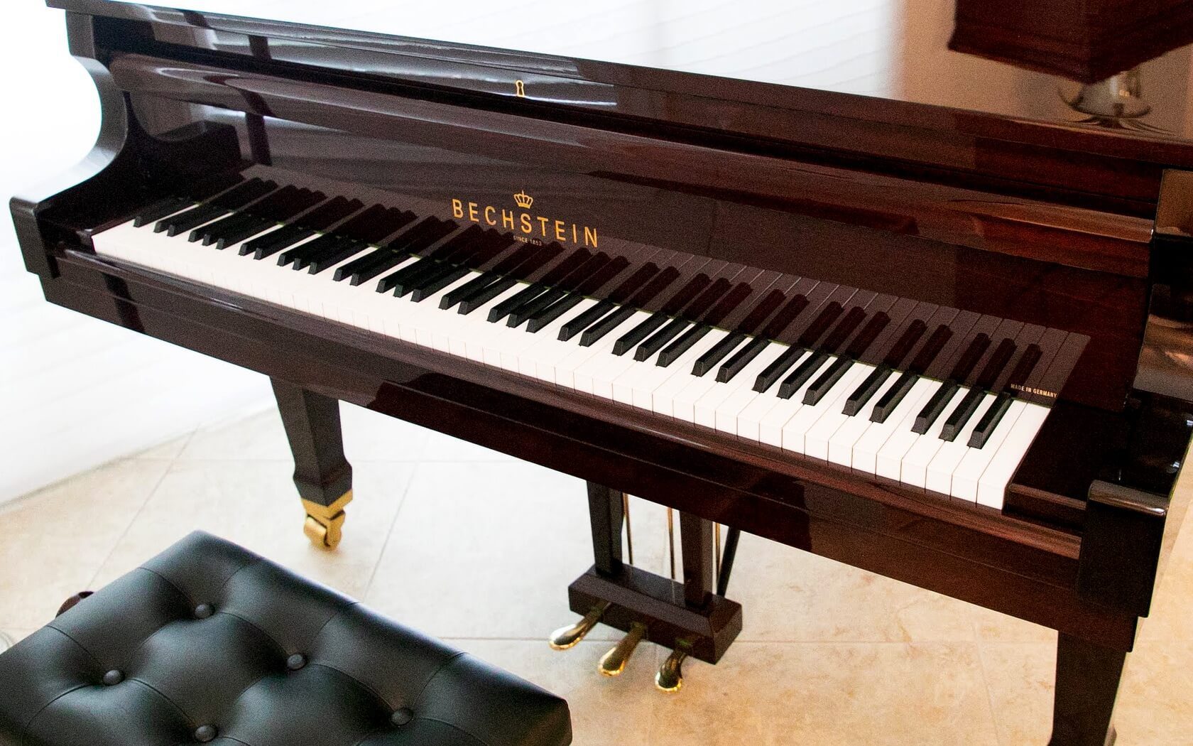 A piano sitting on top of the floor.