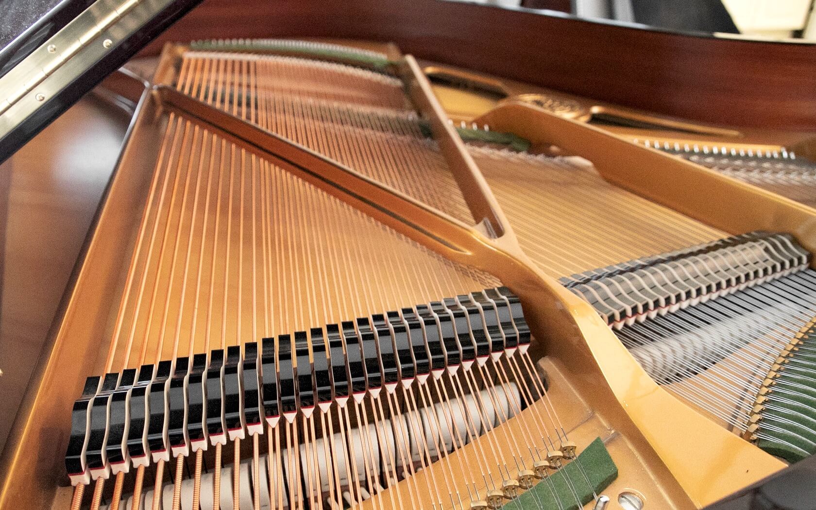 A piano with strings attached to it.