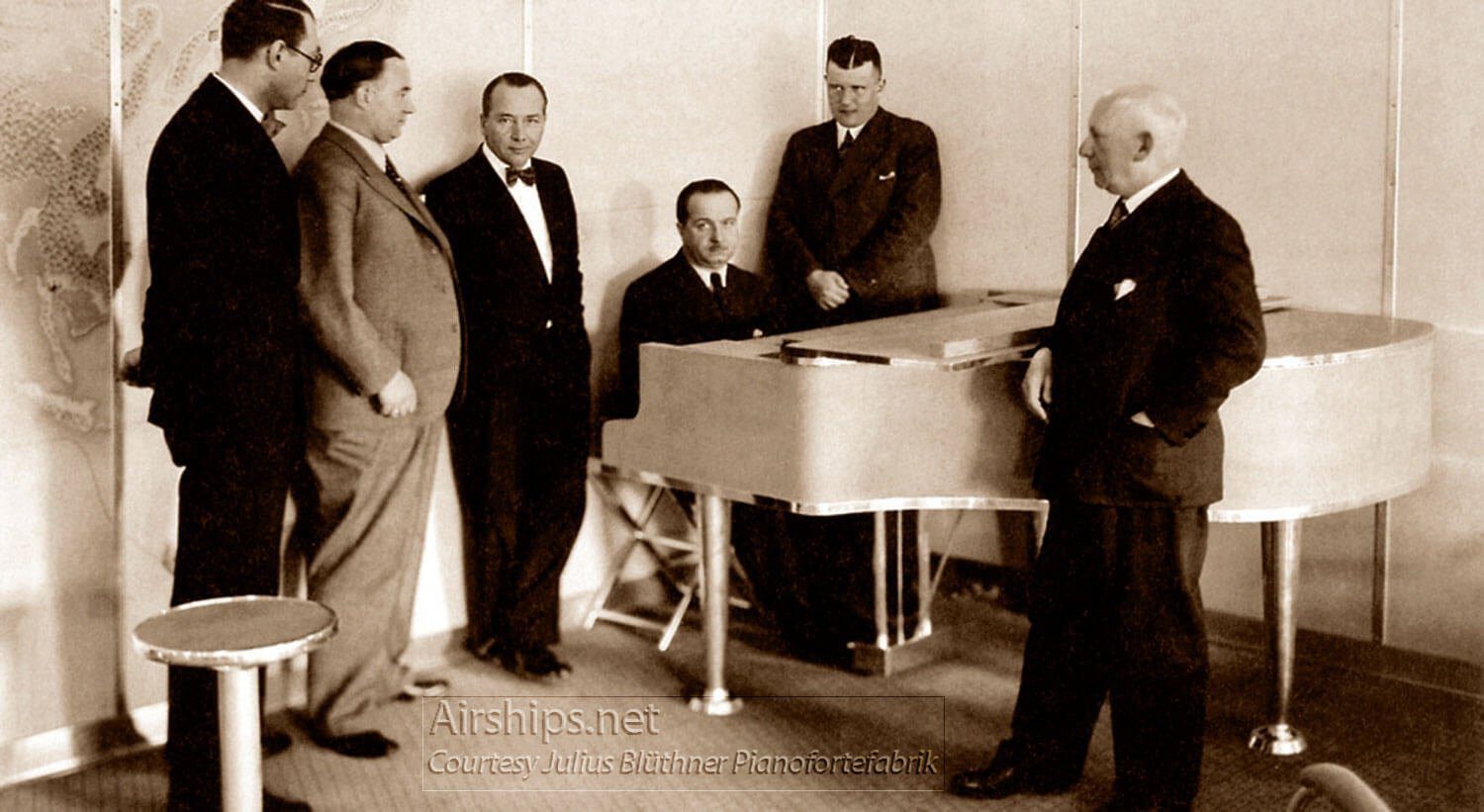 Franz Wagner at Hindenburg’s Piano, with Dr. Rudolf Bluthner-Haessler to his left in the corner, and Captain Ernst Lehmann to his right. Photo courtesy Julius Blüthner Pianofortefabrik.